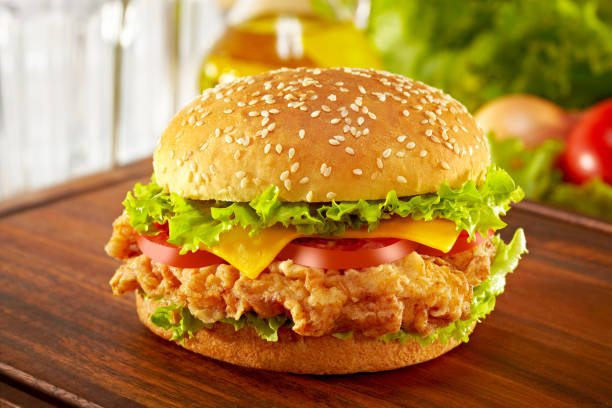 Chicken burger with crispy chicken patty and fresh vegetables
